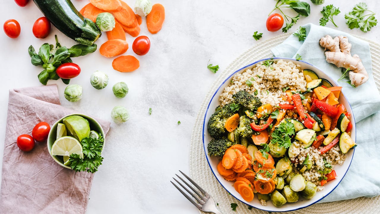 Healthy metabolic foods including berries, vegetables, and supplements on a clean kitchen counter