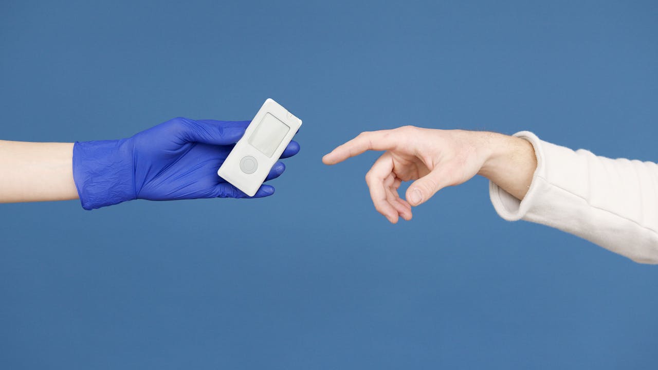 Blood glucose testing equipment alongside berberine supplement bottle on white background