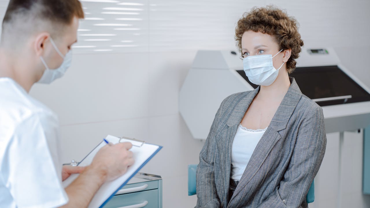 Doctor and patient having an in-person consultation in a medical office