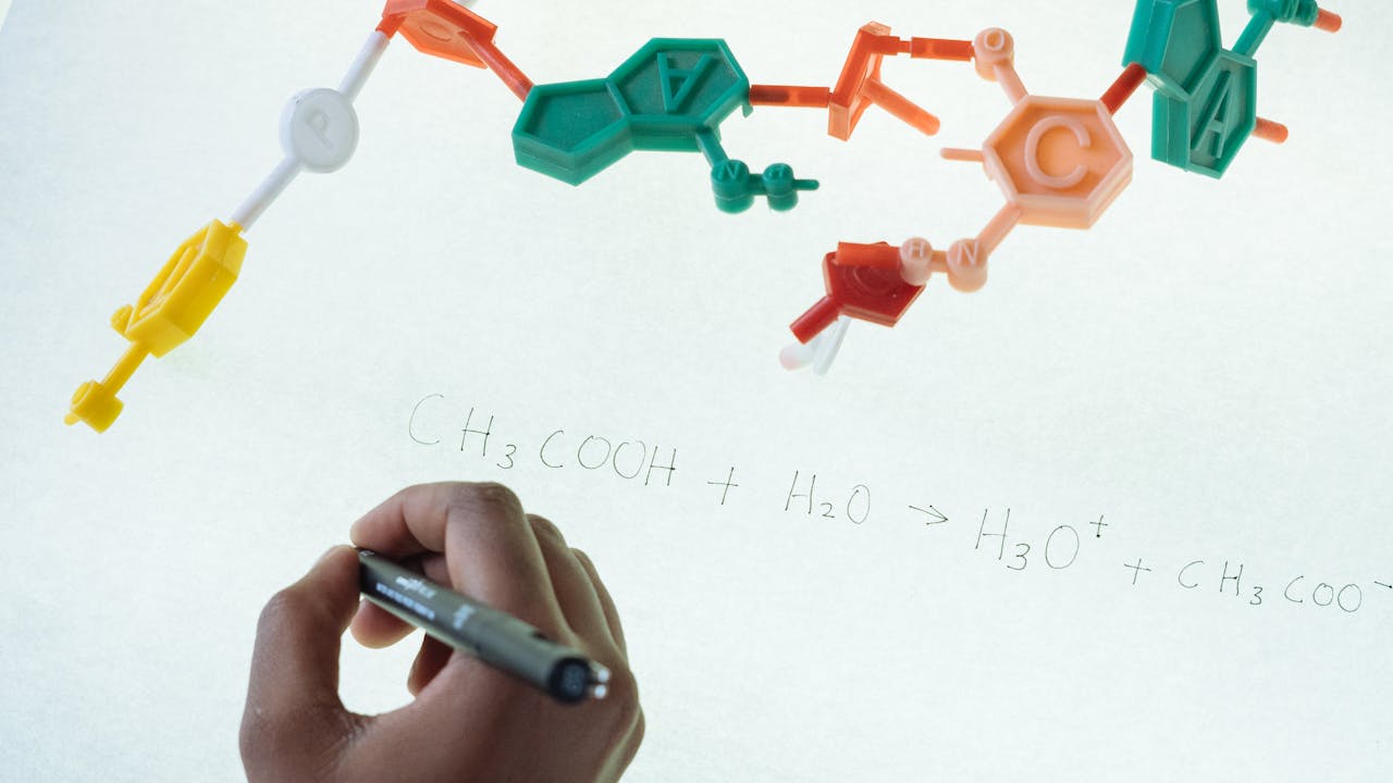 Close-up of supplement capsules and liquid drops in a research laboratory setting