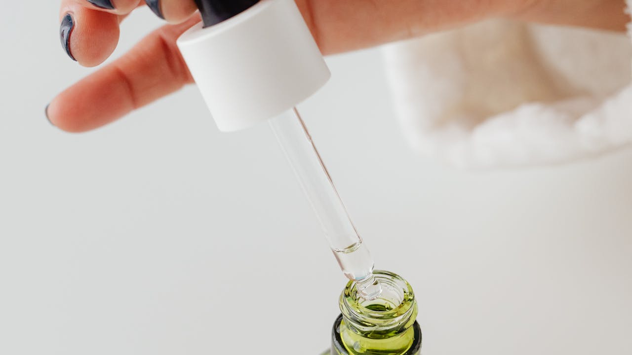 Methylene blue supplement capsules and dropper bottle on a clean white surface with natural lighting