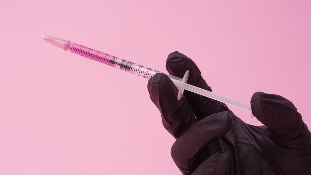 Clinical setting with pharmaceutical vials and injection supplies arranged professionally