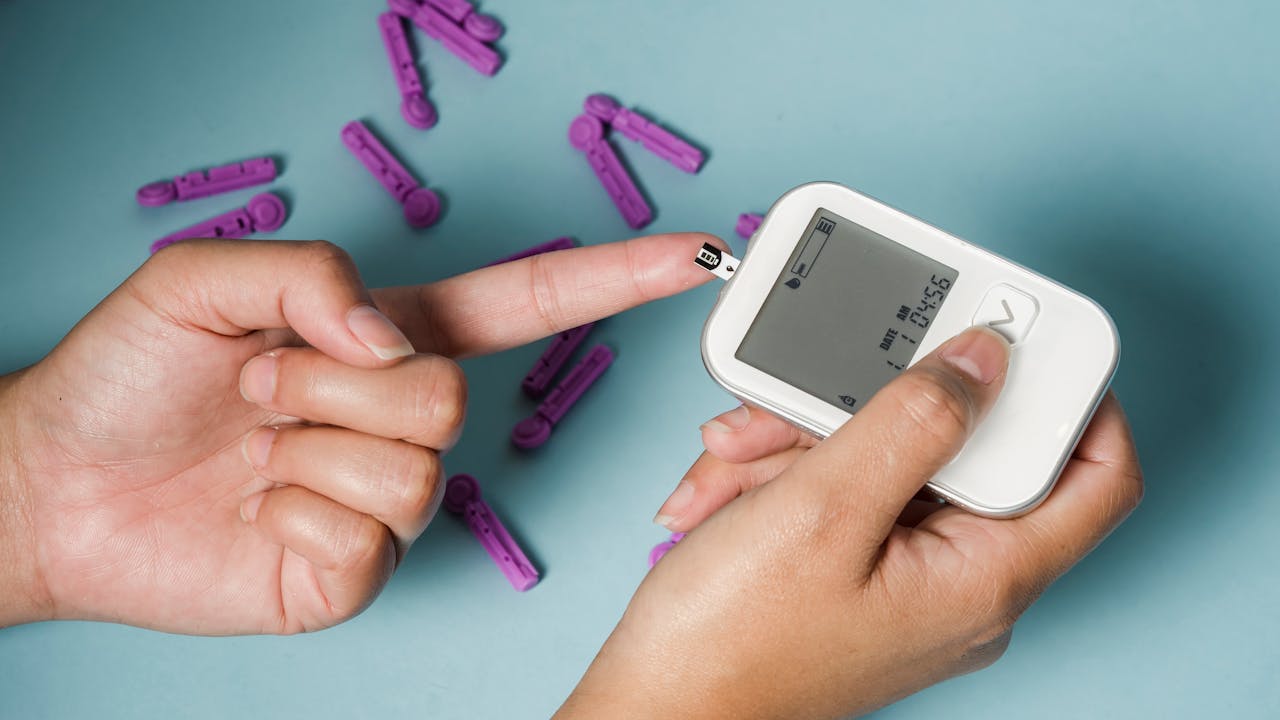 Woman monitoring blood glucose levels representing berberine's blood sugar support
