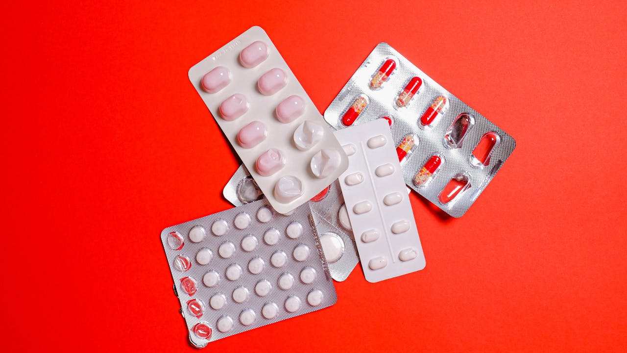 Supplement capsules arranged on a clean white marble surface with morning light
