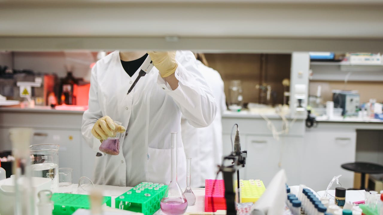Supplement capsules on a clean laboratory surface showing longevity science