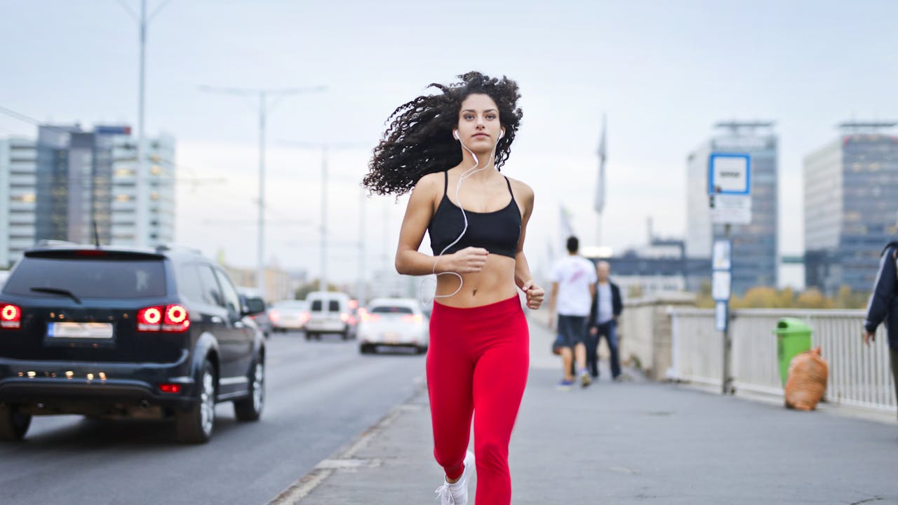 Woman running during athletic training session outdoors